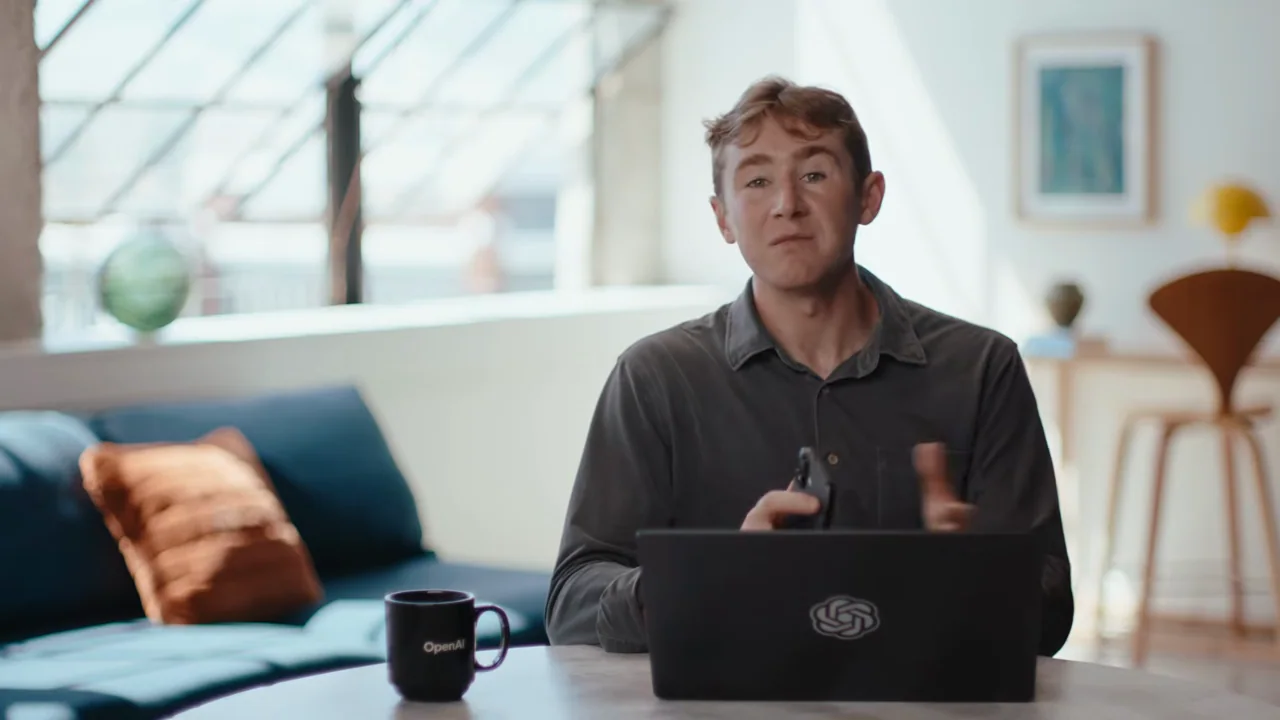 The presenter closes with the laptop and phone.